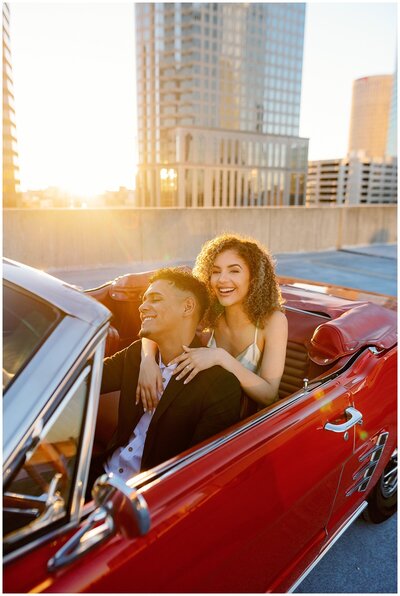 Tampa couple photographer, tampa photographer, tampa commercial photographer, couple in a vintage car on rooftop, clearwater photographer, brand photographer, vintage car photographer