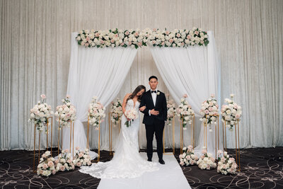 couple posing together at their wedding reception