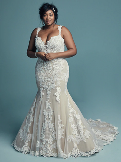 Plus-Size Fit-and-Flare Wedding Dress. This elegant fit-and-flare wedding dress offers additional coverage to our Abbie style, featuring embroidered lace motifs and crosshatching dance over tulle. Chic lace straps glide from the illusion plunging sweetheart neckline to the scoop back, all accented in beaded lace motifs. Lined with shapewear for a figure-flattering fit. Finished with covered buttons over zipper closure.