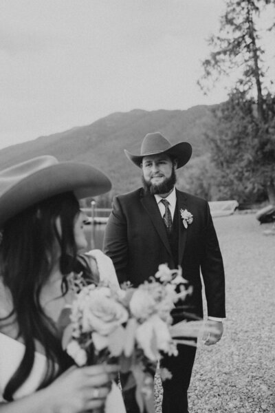 western themed wedding photo in montana with cowgirl and cowboy hats