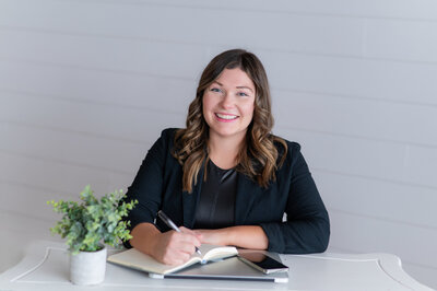 Sarah Hawk, web designer and tech educator writing an organized to do list.