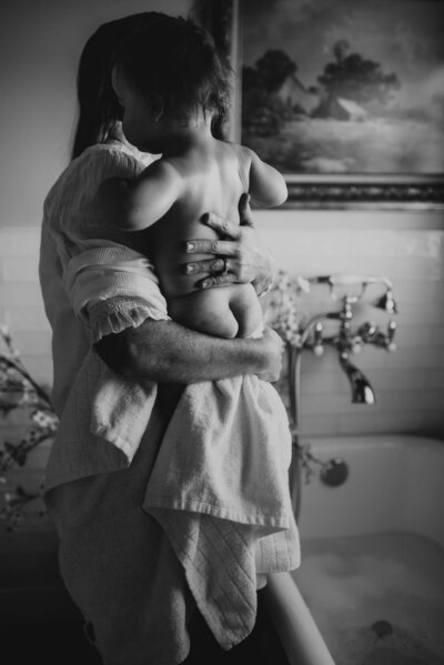 Maternity Photographer, Pregnant woman holding up her toddler