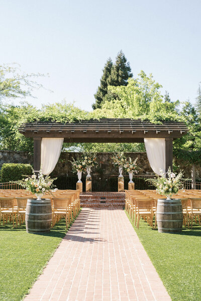 Estate Yountville wedding ceremony set up outside.