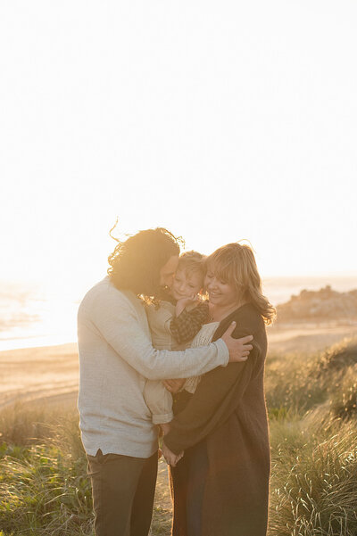 Golden hour family photography on Bournemouth beach – playful and light-filled