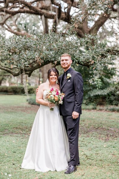 A whimsical portrait of Emily + Justin after their elopement ceremony at Whitefield Square in Savannah, captured as part of our Savannah Elopement Package.