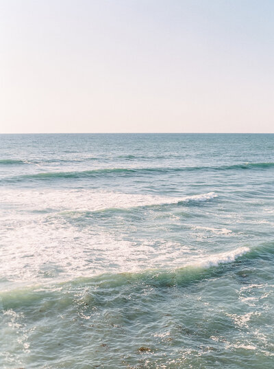 Serene ocean waves providing a scenic backdrop for destination weddings in California, documented by Destination Wedding Photographer Seattle DC.