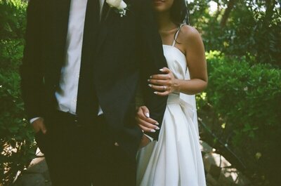 Elizabeth hugging David's arm at Mount Palomar Winery during their bride and groom photos, taken on 35mm film