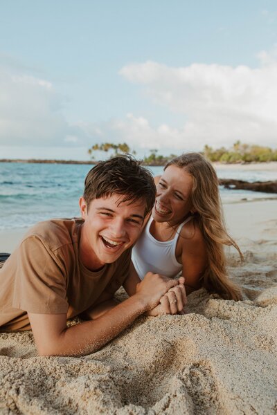 couple laughing on the beach