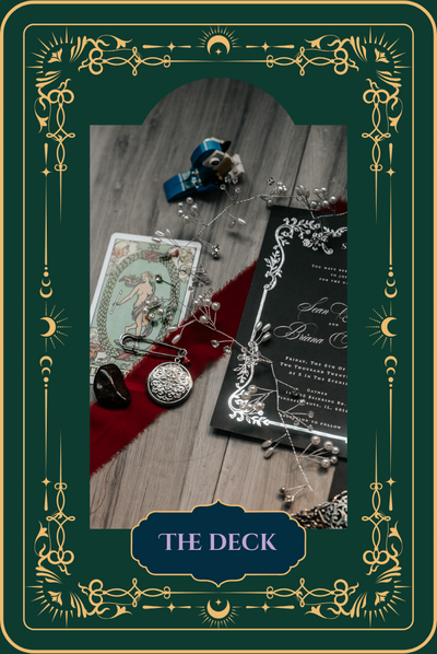 Flatlay of tarot card, wedding invitation, pocket watch, crystals, and jewelry on wooden background - symbolic styling for wedding photography inspiration.