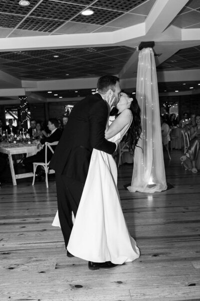 Wedding couples dance with a kiss