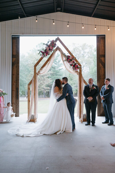 Bride and Bridal Party at Outdoor Ceremony at East Texas wedding Venue The Rosewood Venue in Mount Vernon