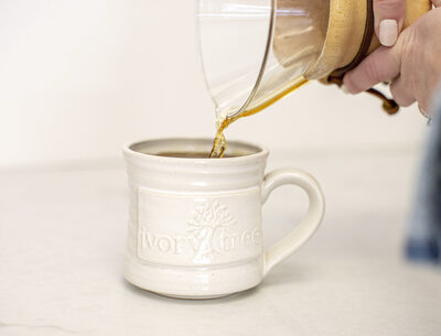 coffee being poured into a mug, for the experience at Ivory Tree Portraits.