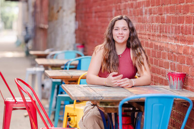 Chesapeake, Virginia photographer, Justine Renee, captures a senior session in a fun alley with colorful decorations.