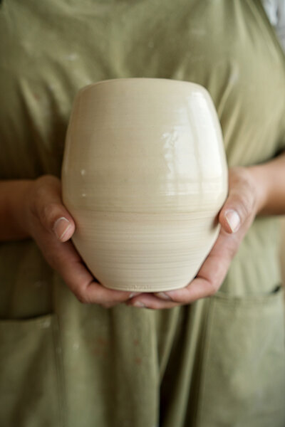 woman-holding-handmade-vase-M6N435H