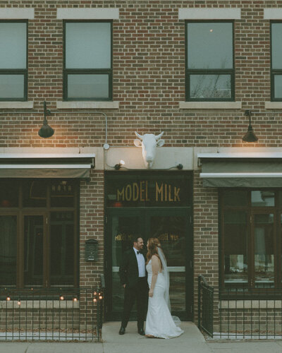bride and groom in Front of Model Milk, Calgary