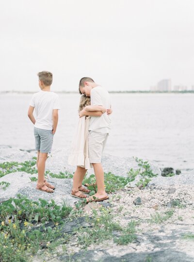 kids hugging at beach from photographing children beginner course