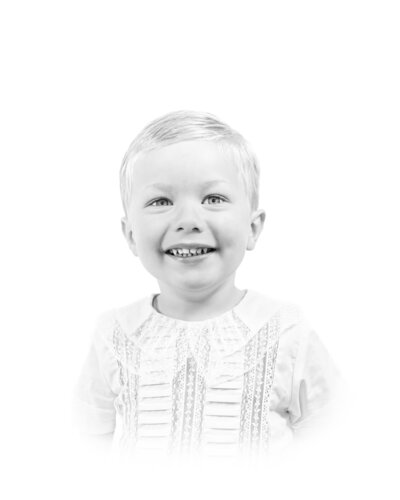 A classic heirloom children's portrait featuring a young toddler with golden hair and bright blue eyes, dressed in a traditional light blue outfit. Timeless children's photography with a soft, painterly background.