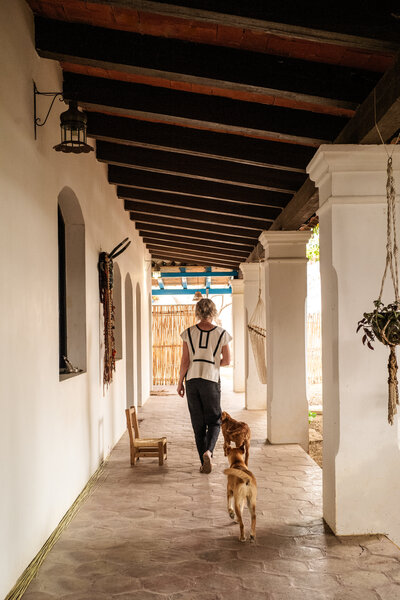 asha taking a walk with dog through town