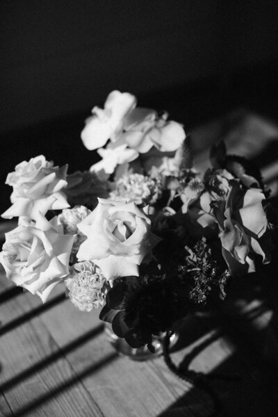 Classic black and white photo of the bride’s posh bouquet featuring textured florals and timeless elegance, captured at an intimate backyard wedding in Richmond, Virginia.