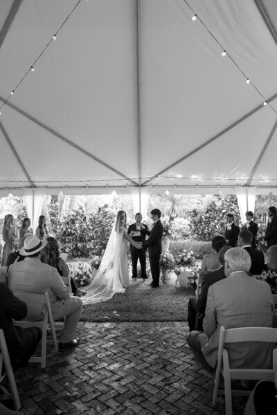 Bride and groom at wedding ceremony by wedding photographers jacksonville fl