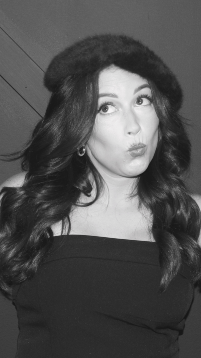 black and white image of brunette making silly face