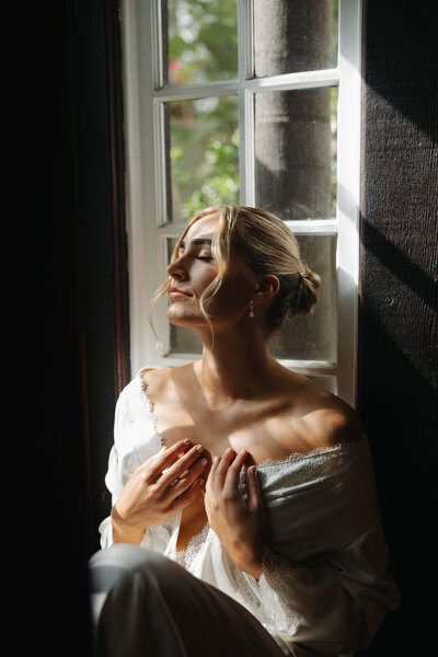 bride getting ready photos, bride sitting on window, rancho las lomas wedding