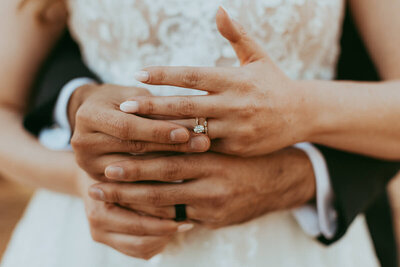 bride and groom exchange rings for photos in Flagstaff