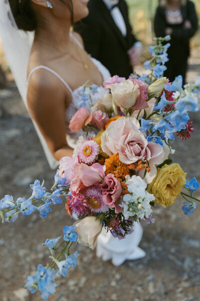 real wedding in alberta showing bride holding bouquet of flowers