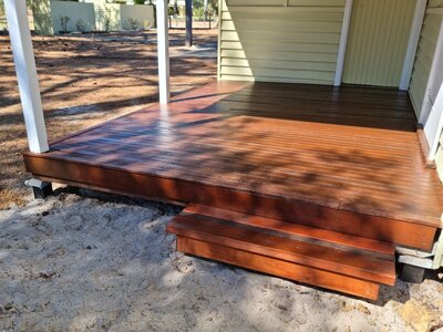 Decking restoration and staining for an outdoor area, bringing weathered timber back to life with New-Style Painting Service.
