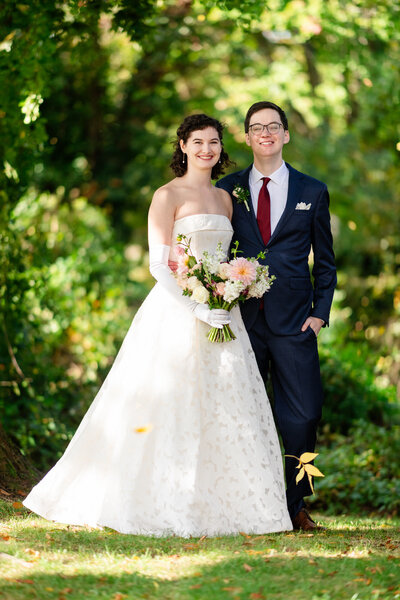 A newlywed couple poses for a portrait at Cedar Knoll Restaurant in Fairfax, Virginia, photographed by Nathan Sottung Photography, a Northern Virginia wedding photographer.
