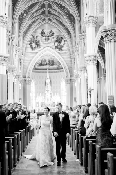 bride and groom walking down the aisle after wedding ceremony