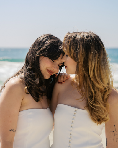 An editorial style groom walking with his jacket open in Chicago, Illinois. 