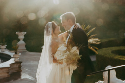 bride and groom looking at each  other