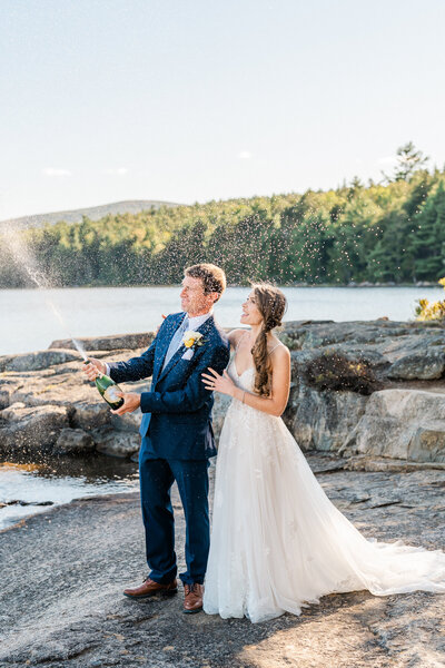 couple kissing on a mountain during their elopement photographed by their New England elopement photographer