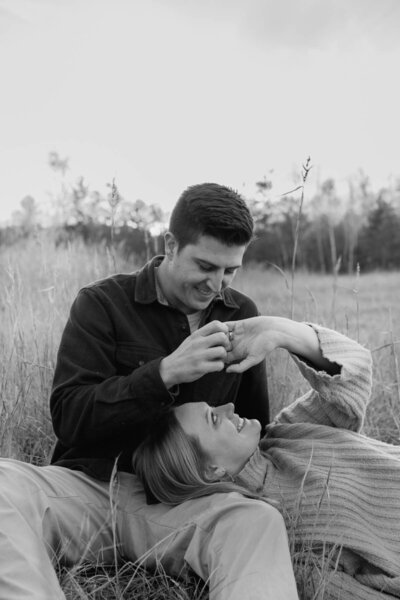 a couple celebrating their engagement with professional photography by taylor hamerski photography, man kissing woman on cheek