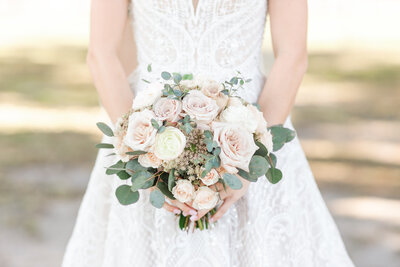 Detailed shot of bride holding her wedding day bouquet