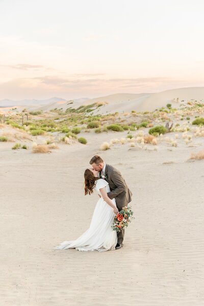 bride and groom at sand dunes