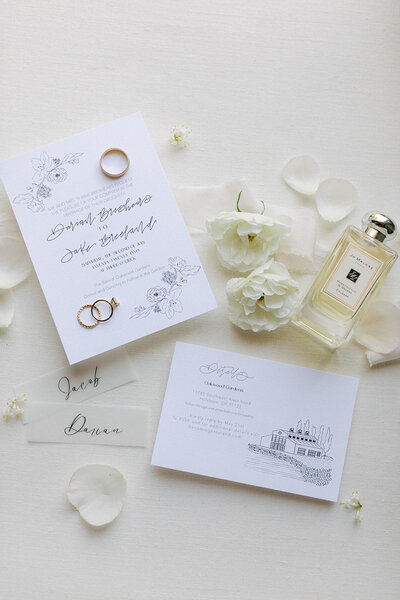 Black and white wedding invitation with floral details, calligraphy and florals representing full service design and calligraphy by Life in Letters.