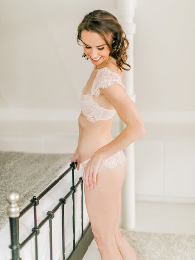 Empowering boudoir session in Chicago studio featuring soft, feminine poses.