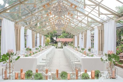 A beautiful wedding venue under a glass roof.
