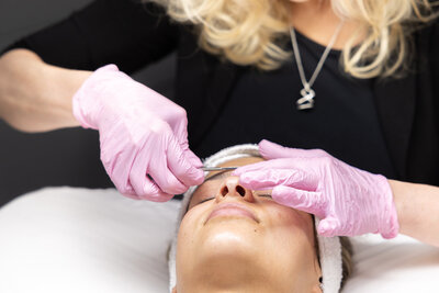 a woman receiving a facial
