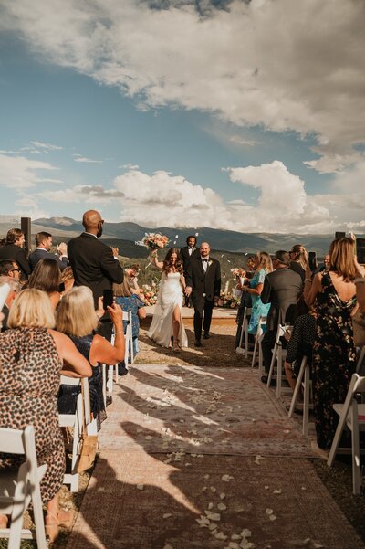 Colorado wedding planner pouring champagne