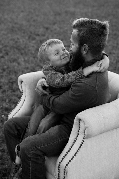 Dad looking down at son | Family Photos