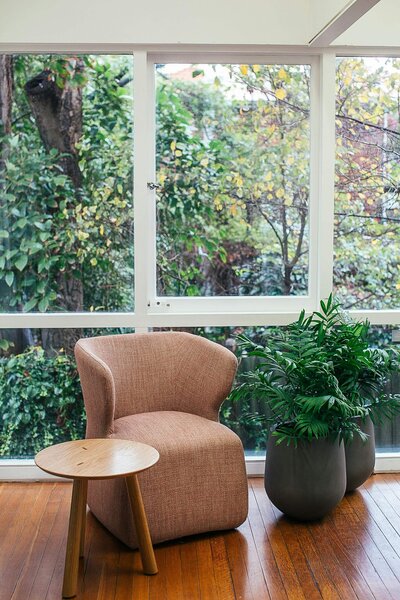 Modern chair and table in brightly lit living space
