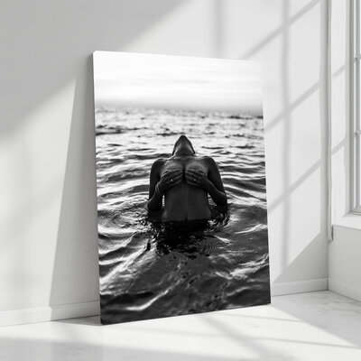 Artful image with a balance of strength and vulnerability in a simple setting.