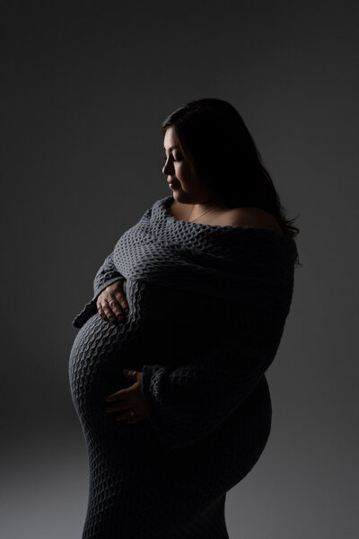 expecting momma gray dress dramatic lighting