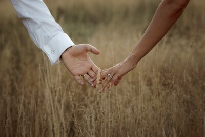 couple holding hands during an engagement shoot in London