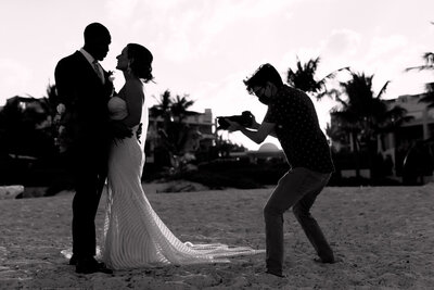 Chris filming a couple’s sunset kiss in Cancun.