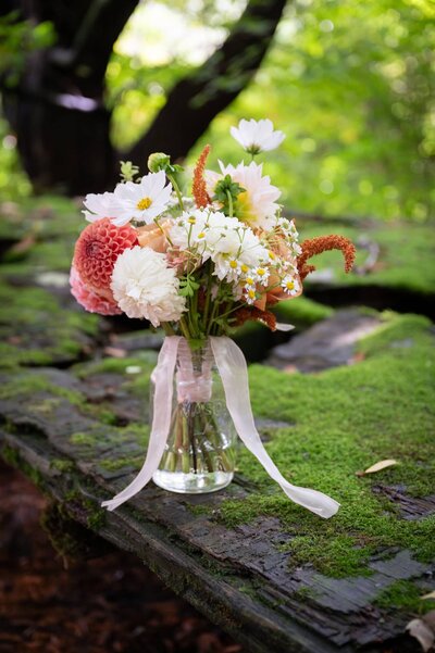 book centerpiece with two orange flowers