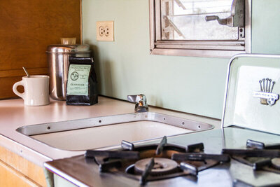 Place marketing closeup stove top sink counter interior mini airstream Gatos Trail Ranch